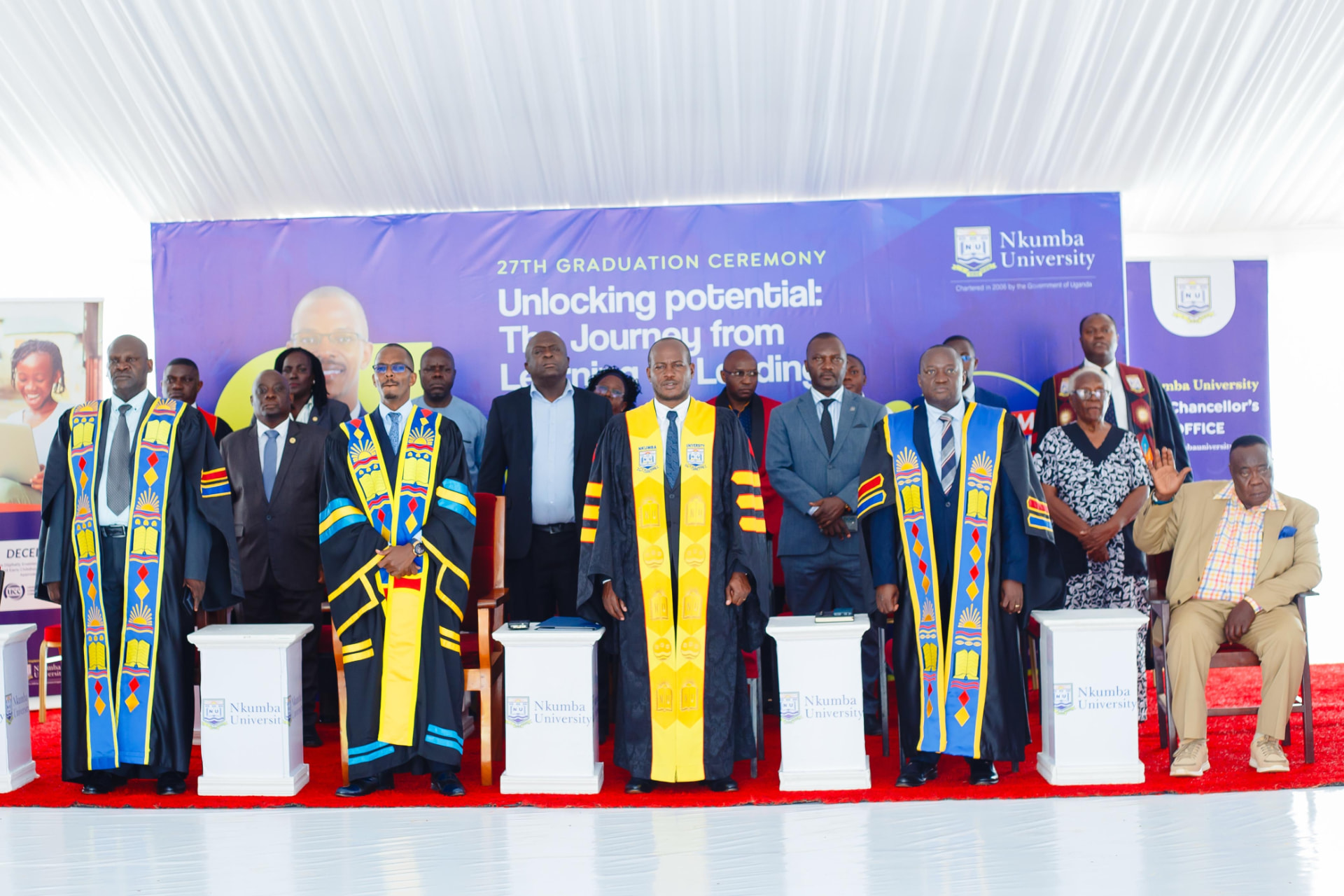 Newton Buteraba on stage at the Nkumba University graduation ceremony