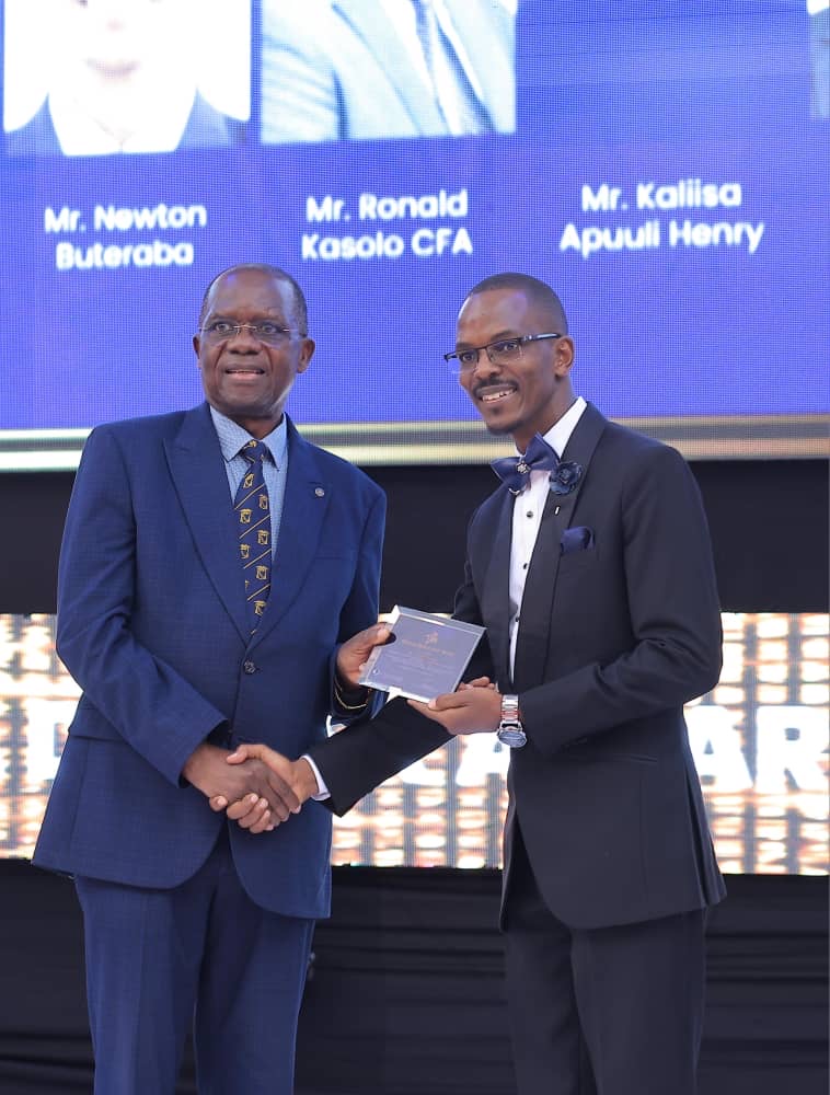 Newton Buteraba receiving an award on stage